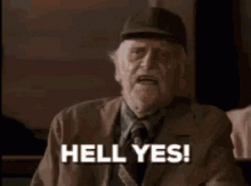 A Man With A Beard And Hat Is Making A Funny Face And Saying `` Hell Yes ! '' GIF