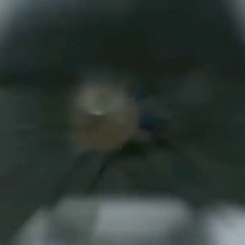 A Man With A Beard And Headphones Is Playing A Video Game .. GIF