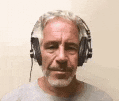 A Man With A Beard And Headphones On His Head . GIF