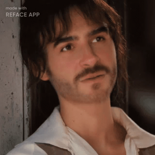 A Man With A Beard And Long Hair Is Being Made With Reface App GIF