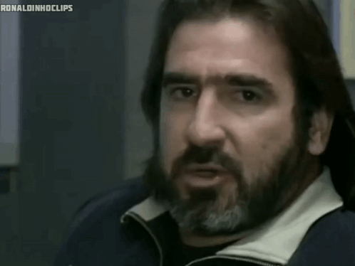 A Man With A Beard And Long Hair Is Saying " Never Grow Up " GIF