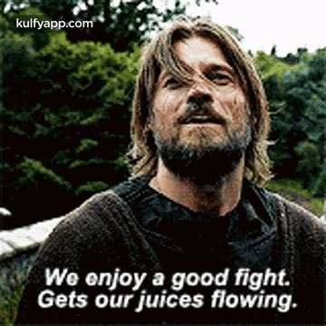 A Man With A Beard And Long Hair Is Talking About A Good Fight . GIF