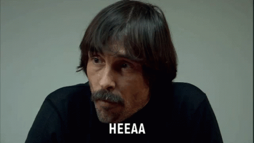 A Man With A Beard And Mustache Has The Word Heeaa On His Face GIF