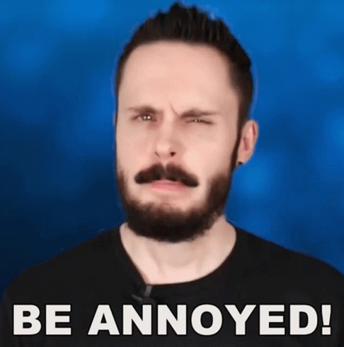 A Man With A Beard And Mustache Is Making A Funny Face With The Words Be Annoyed Written Below Him GIF