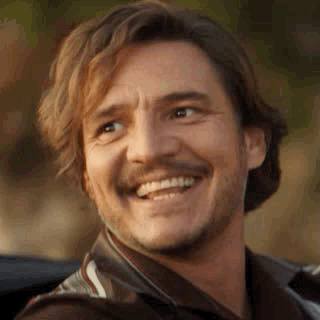 A Man With A Beard And Mustache Is Smiling And Looking Up . GIF