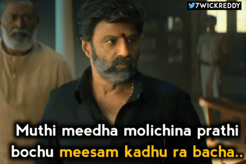 A Man With A Beard And Mustache Is Standing In Front Of A Sign That Says " 7Wickreddy " GIF