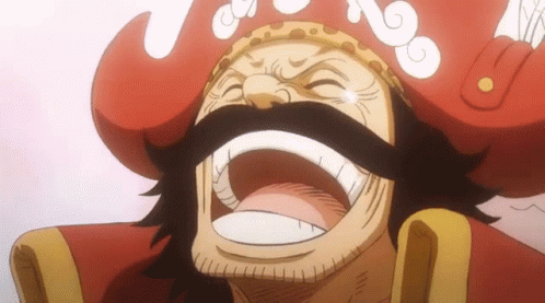 A Man With A Beard And Mustache Is Wearing A Red Hat And Smiling . GIF