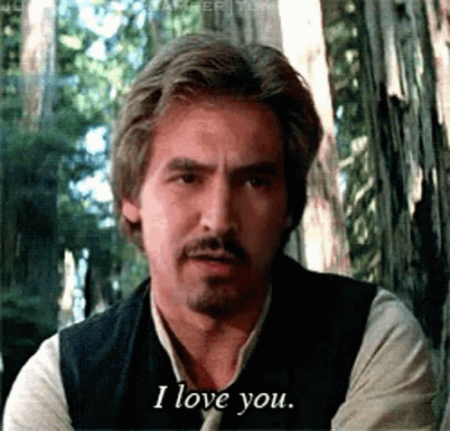 A Man With A Beard And Mustache Says I Love You GIF
