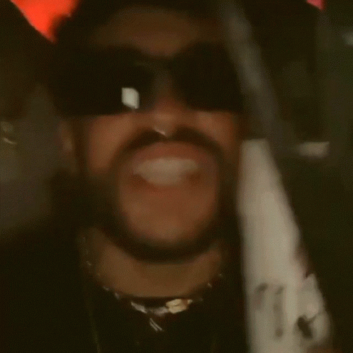 A Man With A Beard And Nose Ring Wears Sunglasses GIF
