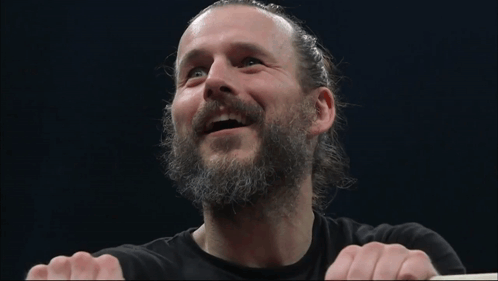 Smiling Man With Beard And Ponytail GIF
