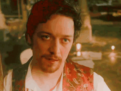 A Man With A Beard And Red Hair Is Wearing A Red Vest GIF