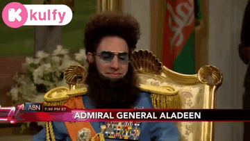 Bearded Man With Sunglasses Behind Admiral General Aladeen GIF