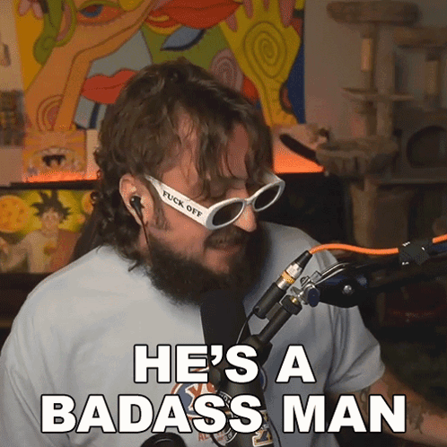 A Man With A Beard And Sunglasses Says He 'S A Badass Man In Front Of A Microphone GIF