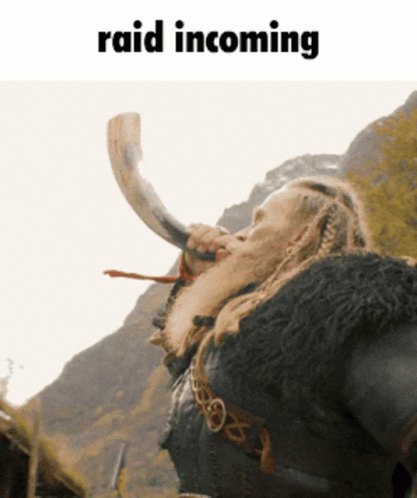 A Man With A Beard Blowing A Horn With The Words Raid Incoming Above Him GIF