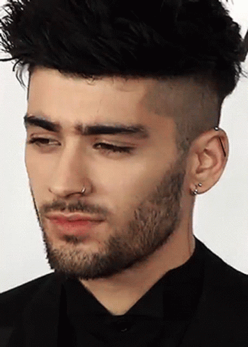 A Man With A Beard Has A Nose Ring On His Left Ear GIF