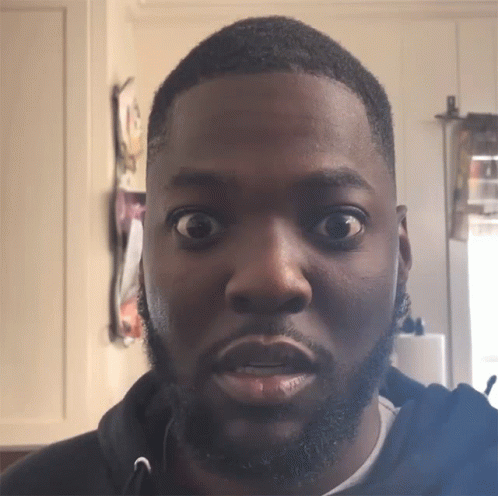A Man With A Beard Has His Eyes Wide Open GIF