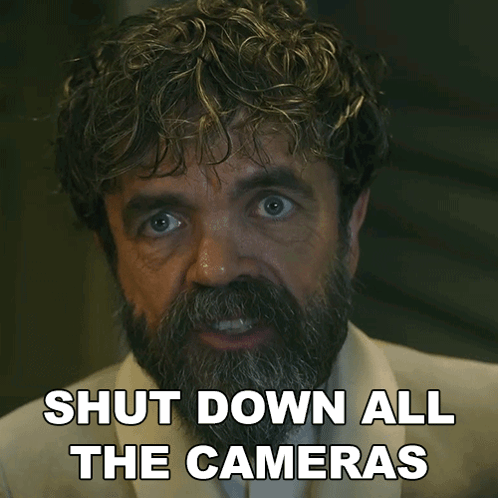 A Man With A Beard Has The Words Shut Down All The Cameras On His Face GIF
