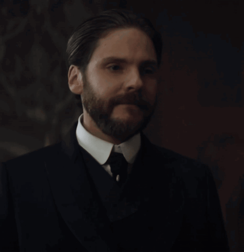 A Man With A Beard In A Suit And Tie GIF