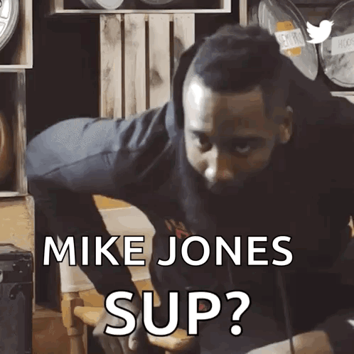 A Man With A Beard Is Asking Mike Jones To Sup GIF