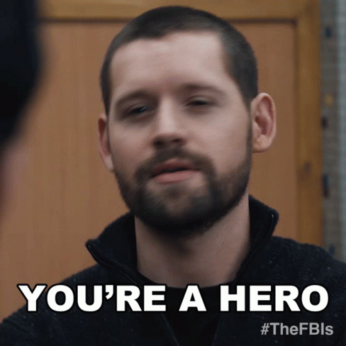 A Man With A Beard Is Being Called A Hero GIF