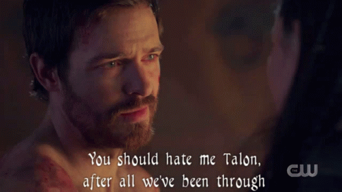 a man with a beard is being comforted by a woman who says you should hate me talon after all we have been through