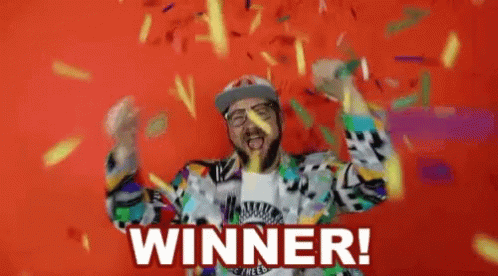 A Man With A Beard Is Celebrating With Confetti And The Words Winner Written On The Bottom GIF