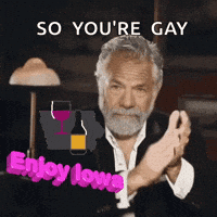 a man with a beard is clapping and says so you 're gay