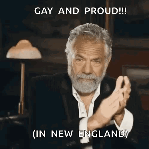 A Man With A Beard Is Clapping His Hands And Says Gay And Proud GIF