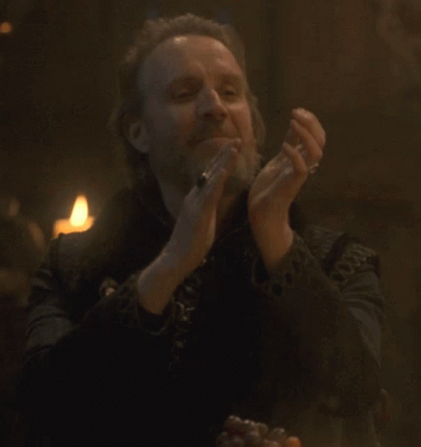 A Man With A Beard Is Clapping His Hands GIF
