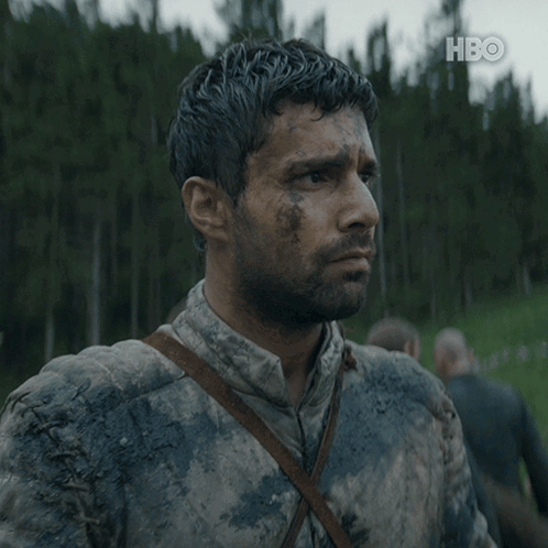 A Man With A Beard Is Covered In Mud And Hbo Is Displayed On The Bottom Right GIF