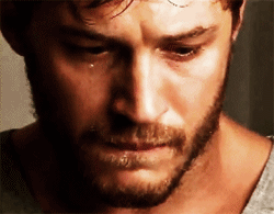 A Man With A Beard Is Crying With A Tear Running Down His Cheek GIF
