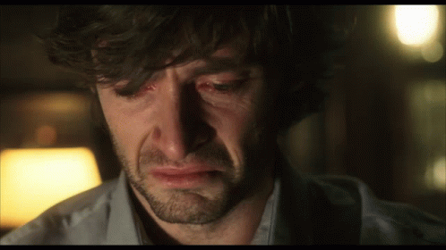 A Man With A Beard Is Crying With Tears Coming Out Of His Eyes GIF