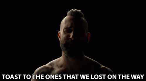 A Man With A Beard Is Crying With The Words Toast To The Ones That We Lost On The Way Below Him GIF
