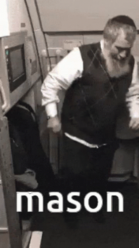 A Man With A Beard Is Dancing In A Room With The Word Mason Written On The Bottom GIF
