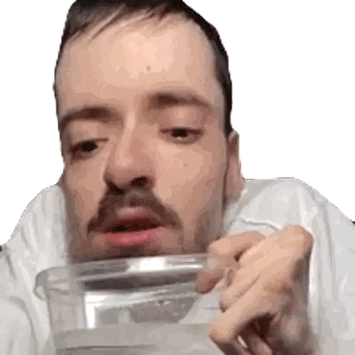 a man with a beard is drinking from a clear plastic cup