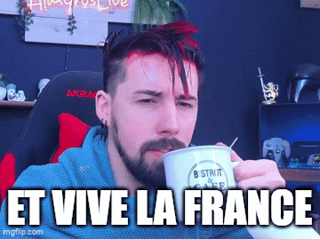 A Man With A Beard Is Drinking From A Mug That Says " Et Vive La France " On It GIF