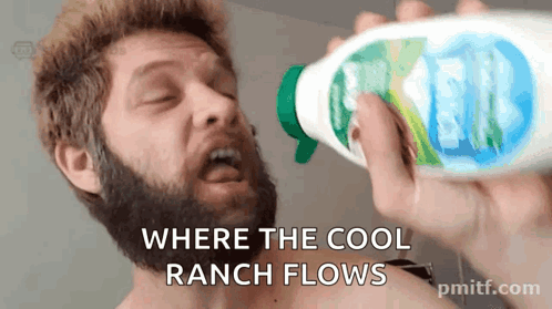 a man with a beard is drinking from a spray bottle with the words " where the cool ranch flows "