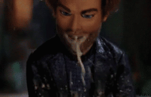 A Man With A Beard Is Eating Spaghetti With His Mouth Open GIF