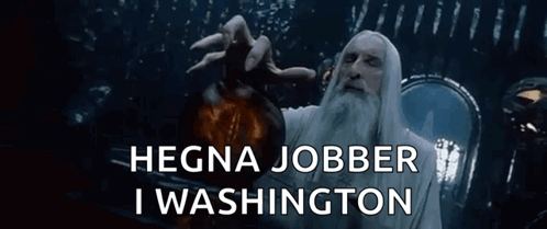 A Man With A Beard Is Holding A Bottle With The Words " Hegna Jobber I Washington " Above Him GIF