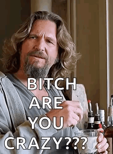 A Man With A Beard Is Holding A Glass Of Milk And Says " Bitch Are You Crazy " . GIF