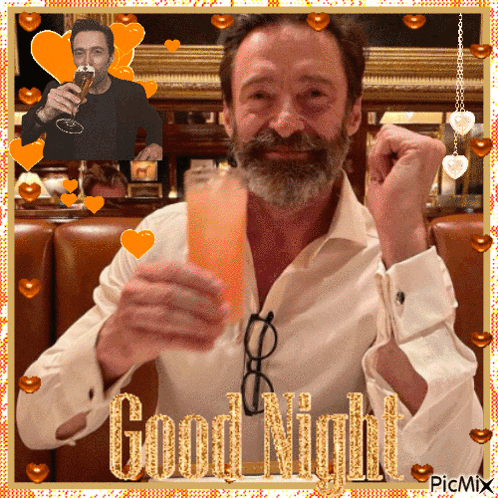 A Man With A Beard Is Holding A Glass Of Orange Liquid With The Words Good Night Written On It GIF
