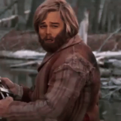 A Man With A Beard Is Holding A Glass Of Wine With A Bubble With The Letter B On It GIF