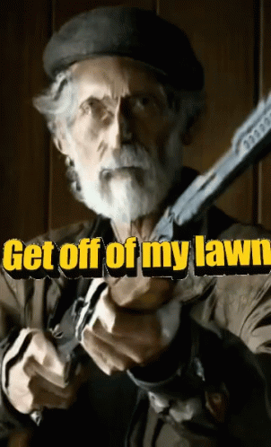 A Man With A Beard Is Holding A Gun With The Words Get Off Of My Lawn Behind Him GIF