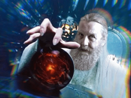 A Man With A Beard Is Holding A Red Sphere In His Hand GIF