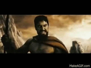 A Man With A Beard Is Holding A Sword In A Battle Scene From The Movie 300 . GIF