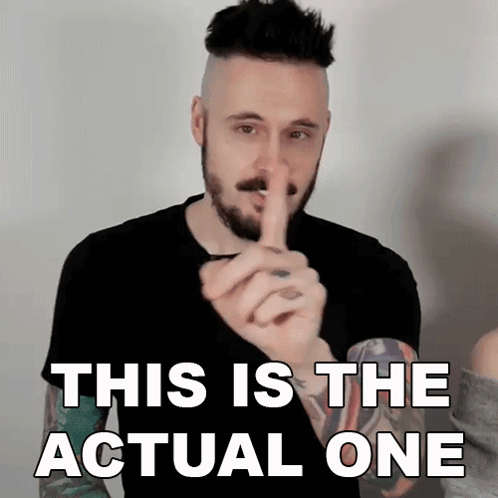 A Man With A Beard Is Holding His Finger To His Mouth And Says This Is The Actual One GIF