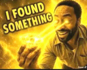 A Man With A Beard Is Holding Something In His Hand And Says I Found Something GIF