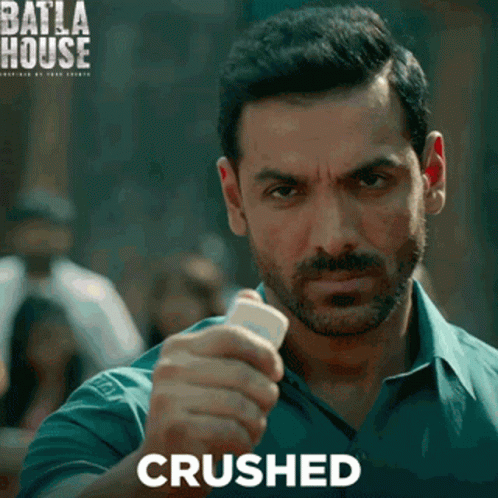 A Man With A Beard Is Holding Something In His Hand And The Word Crushed Is On The Bottom GIF