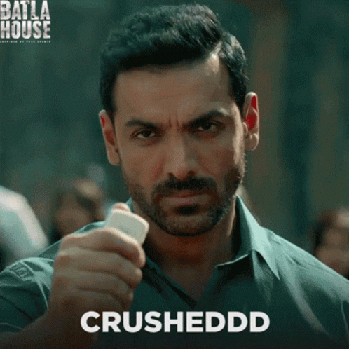 A Man With A Beard Is Holding Something In His Hand And The Word Crushedd Is On The Bottom GIF