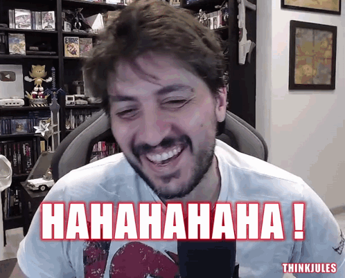 A Man With A Beard Is Laughing In Front Of A Microphone With The Words ' Hahahaha ! ' Below Him GIF